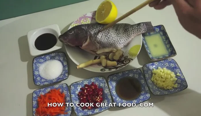 Score the tilapia fish all the way to the bone to allow ingredients to penetrate.