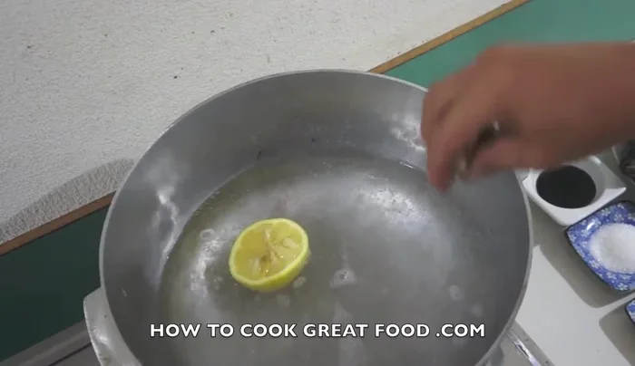 In a boiling pot, add lemon juice and galangal for extra flavor.