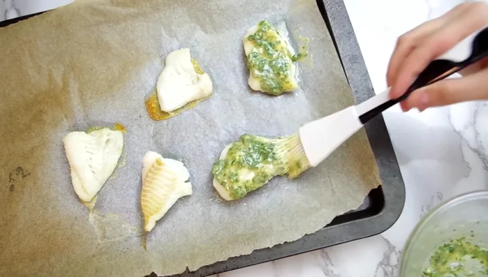 Once the fish is cooked, brush generously with the tahini-herb mixture and let it sit for a few minutes.