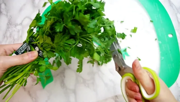 Chop fresh herbs (parsley, cilantro, oregano, basil).