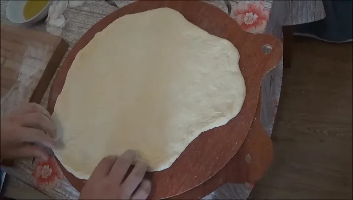 For the m'srouk: On a floured surface, add olive oil to the dough, stretching and folding it repeatedly, adding more olive oil and semolina as you work.