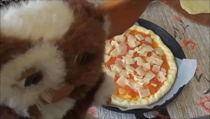 Bake the pizza at 200°C for 15 minutes.