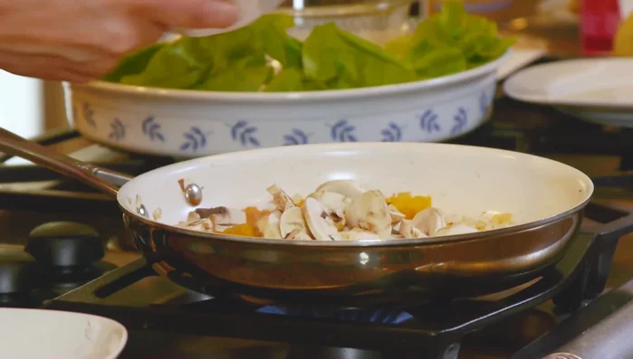 Add sliced mushrooms and stir.