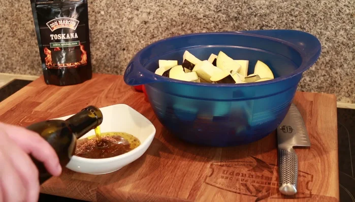 Season the veggies: Add 2 tablespoons of Don Marco Tuscan seasoning (or McCormick), 3 tablespoons olive oil, to the bowl. Mix well and let rest for about a minute.