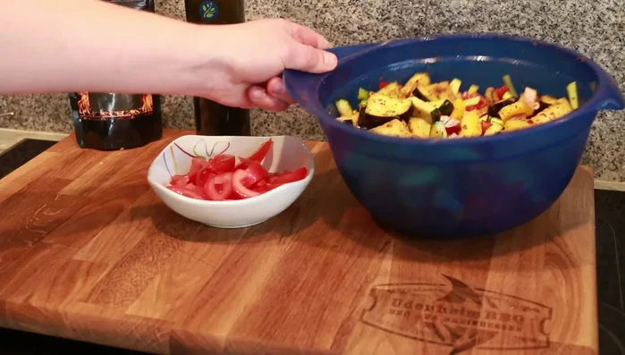 Prepare tomatoes: Cut tomatoes into small pieces, removing the seeds. Set aside.
