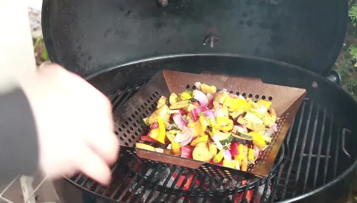 Grill the veggies: Place the marinated veggies in the stainless steel grilling pan on the hot grill. Grill for 2-3 minutes, then stir and cook for another 5 minutes, keeping the lid closed.