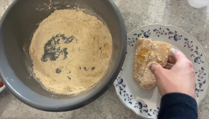 Dredge the fish fillets in the flour mixture, ensuring all sides are coated.
