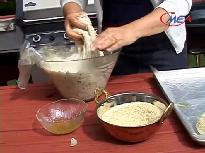 Place the dough balls on a baking tray lined with plastic wrap.