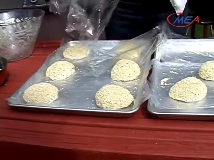Cover the dough balls with saran wrap and let them rest for 15-20 minutes.