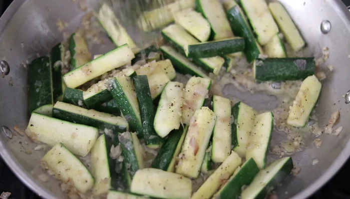 After 6-8 minutes, add minced fresh thyme. Reduce heat to medium-low. Continue to sauté for another 3-4 minutes.
