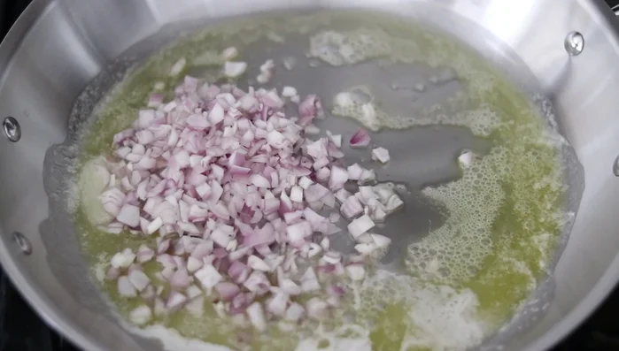 Add minced shallots (or diced onion) and stir. Season with salt and pepper. Cook for 2-3 minutes until softened.
