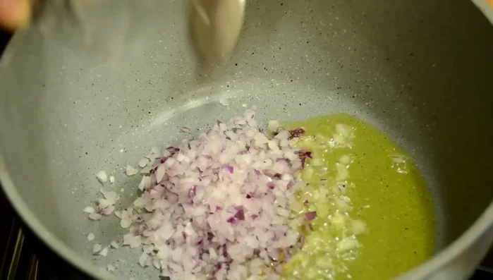 Add onion and garlic, cook for a little bit.