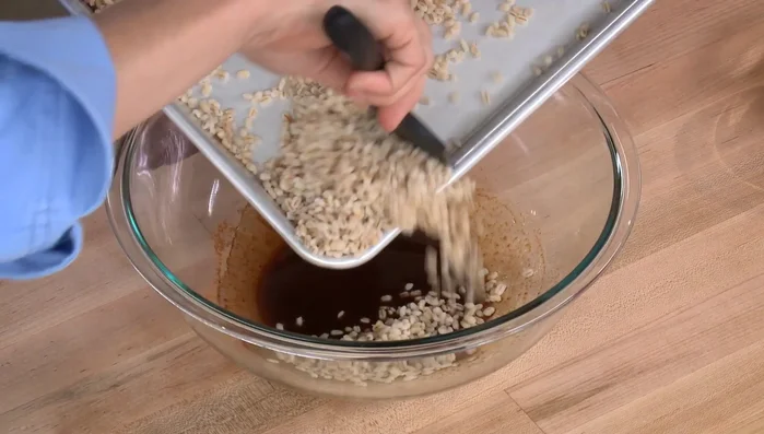 Add the cooled barley to the bowl.