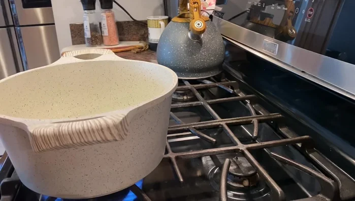 Mix the reserved cup of milk with the cornstarch and sugar to form a smooth paste before adding it to the saucepan.