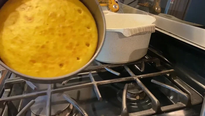 Once the cake is cool, poke holes about an inch apart using a wooden spoon.