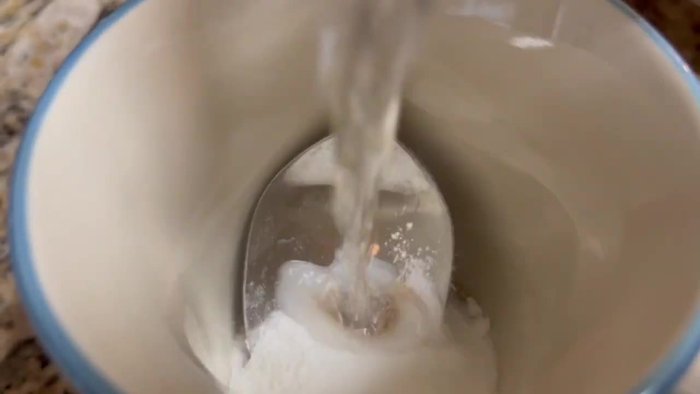 In a cup, mix sugar and yeast with warm water. Let it proof.