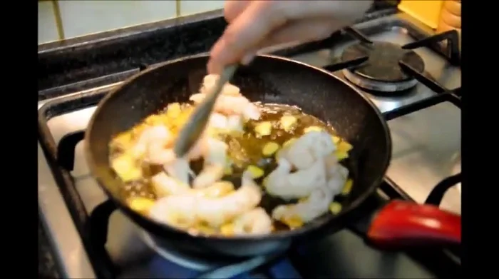 Add the shrimp to the pan and cook for about 2.5 minutes, stirring occasionally, until pink and curled.