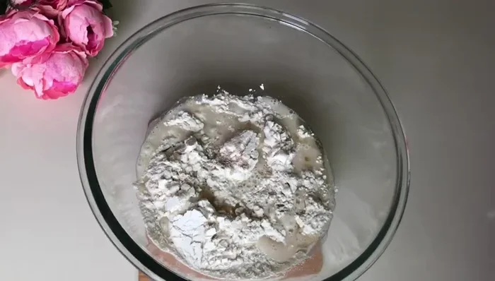 Gradually add room temperature water, mixing until a soft, pliable dough forms. Do not make it too hard.