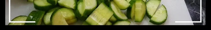 Cut the cucumbers in half and slice them.