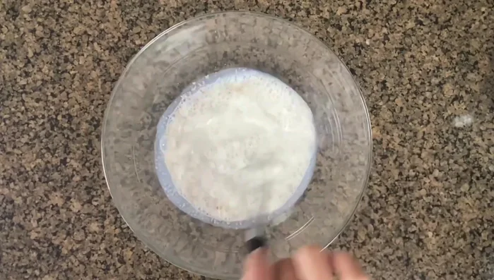 In a separate bowl, combine salt, vegetable oil, olive oil, and flour. Mix using a dough mixer or by hand until smooth.