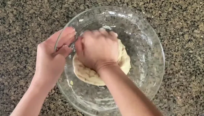 Knead the dough for a few minutes. Coat the dough with nonstick spray, wrap in plastic wrap, and let it rest for about two hours.