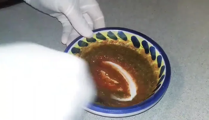 Clean the king prawns by removing the intestines using scissors and water. This step is crucial for a better taste.
