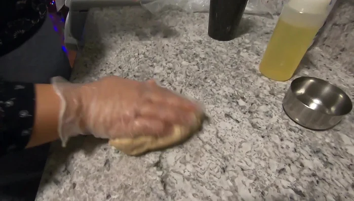 Lightly oil the dough and let it rest for a few minutes.