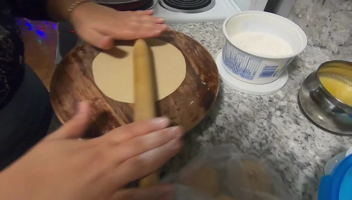 Roll each ball into a thin, circular roti using a rolling pin. Aim for even thickness, but don't worry about perfection.