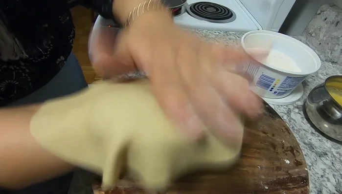 Remove excess flour from the roti before cooking.