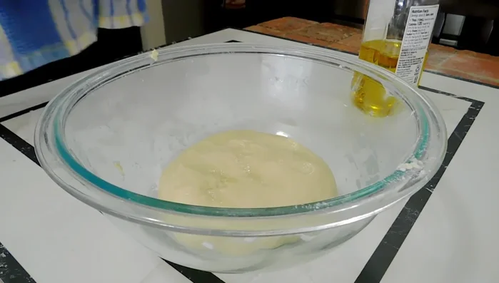 Let the dough rise: Add olive oil to a bowl and place the dough in it. Let it rest for 45 minutes to 1.5 hours (139.08)
