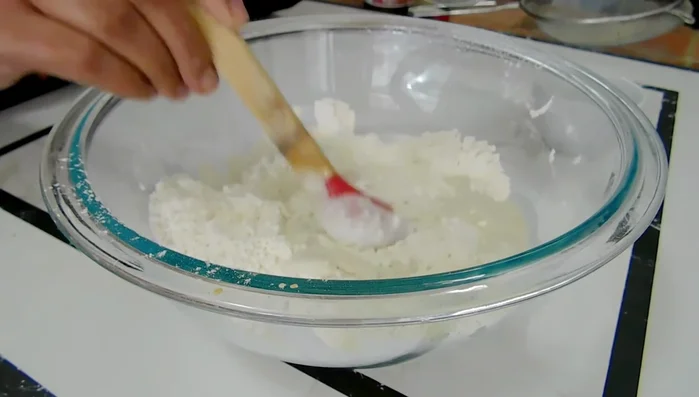Combine wet and dry ingredients: Add the yeast mixture to the flour mixture. You may need to adjust the liquid amount (75.36)