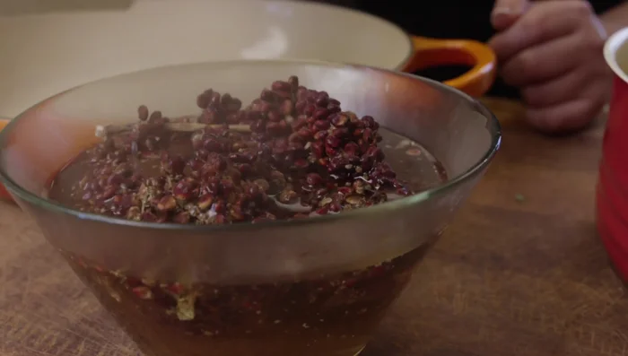 Prepare the sumac sauce: Soak sumac in hot water to create a sour taste.