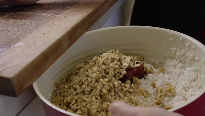Add chopped mint, cumin, black pepper, chili powder, and a little olive oil to the rice mixture.