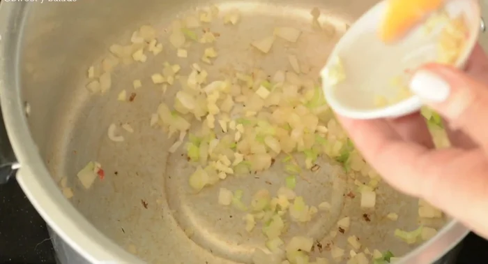 Add chopped green onion and garlic; cook for 1 minute.