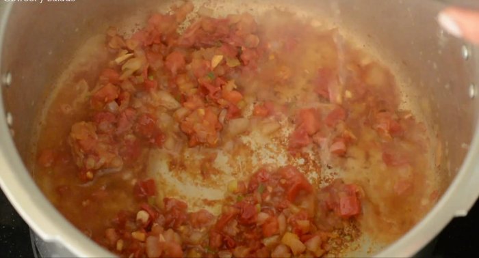 Carefully add water or chicken broth.