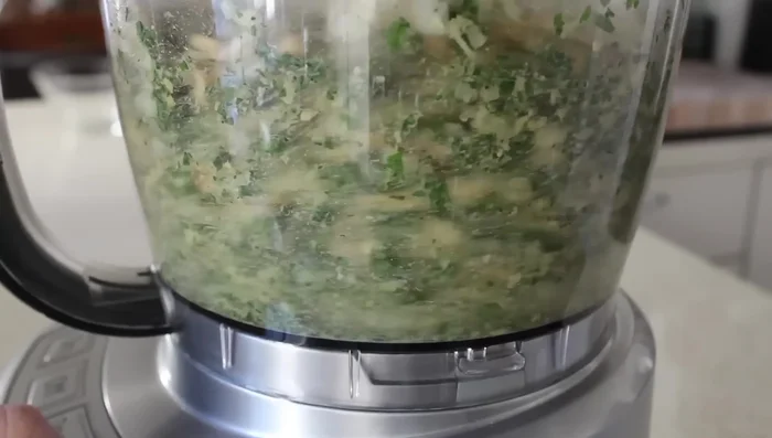 Process the mixture in pulses until finely ground, but not pureed. Scrape down the sides halfway through.