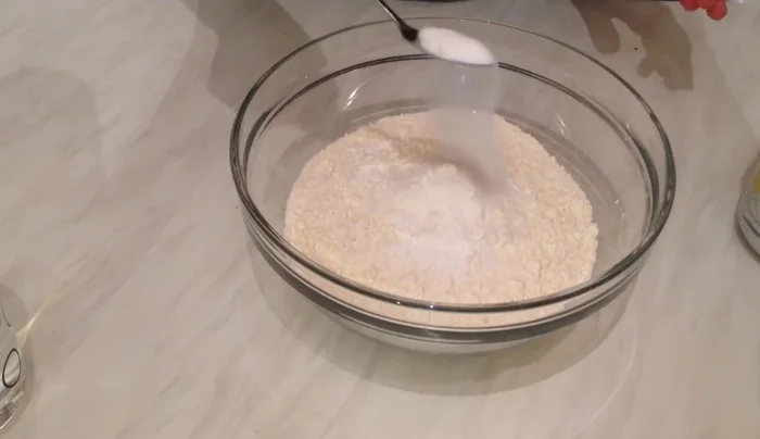 Add yeast, oil, yogurt, and mix well.