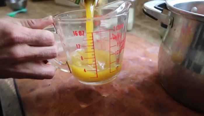 Add 2 cups of vegetable broth and 2 cups of water to the pot.