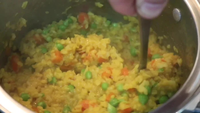 Remove from heat and stir in frozen peas.