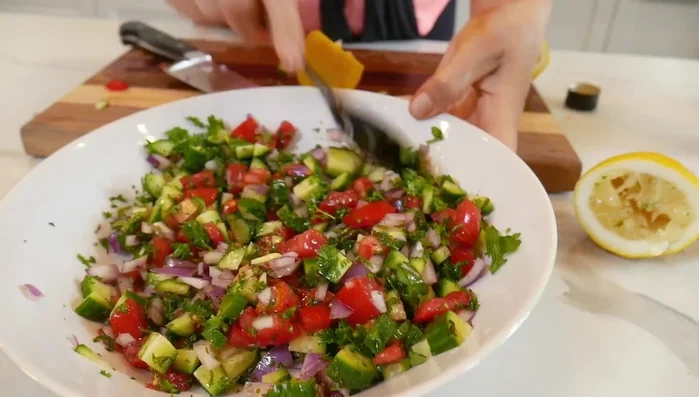 Pour the dressing over the salad and gently mix to combine. Add salt at the very end to prevent the vegetables from releasing too much water.