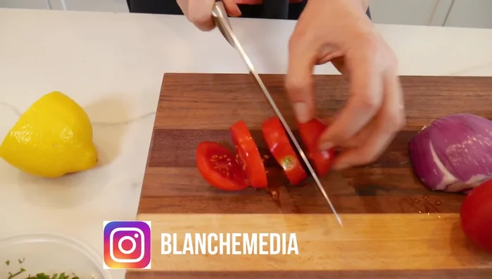 Cut the tomatoes, red onion, and Persian cucumbers into small cubes. Persian cucumbers are preferred; avoid English cucumbers due to their high water content.
