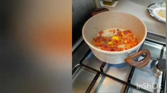 Add the chopped onions and tomatoes to the pot and sauté until softened.