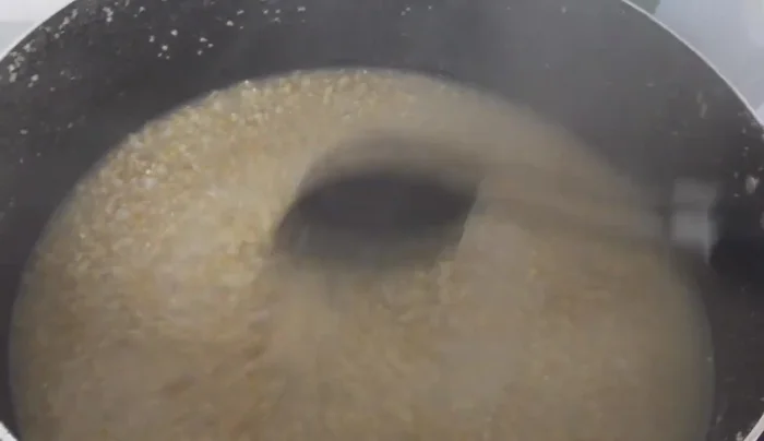 Add a sprinkle of salt to the cooked wheat.
