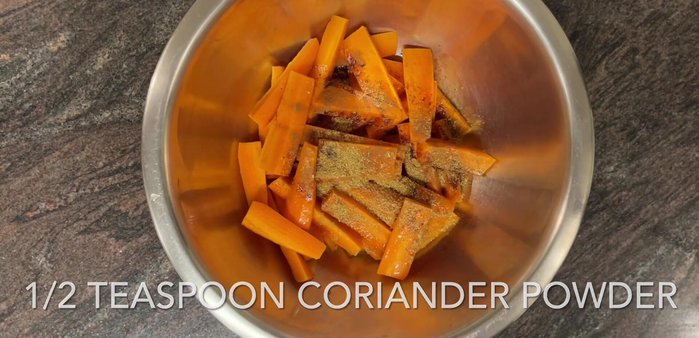In a bowl, combine carrots with 1 tbsp olive oil, ½ tsp each of cinnamon, coriander, cumin, salt, and paprika. Toss to coat evenly.