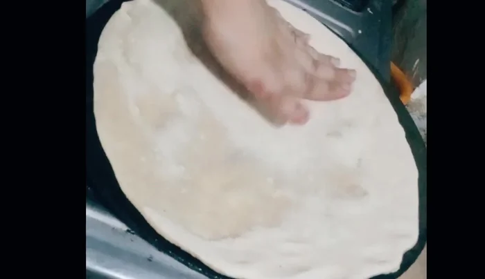 Cook the rotis on a heated pan until bubbles form on one side, then flip and cook the other side.