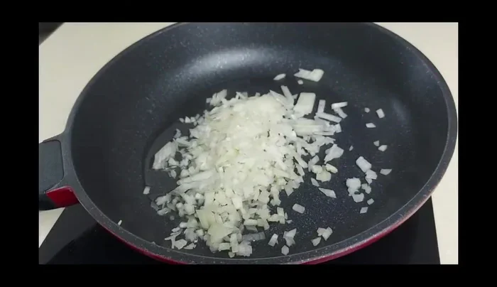 In a pan, sauté a chopped medium onion until soft.