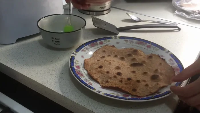 Brush melted butter on the cooked flatbreads.