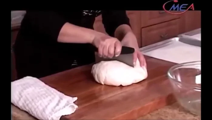 Shape the buns: Divide the dough in half, then each half into six portions. Shape each portion into an oval. (Start: 278.56)