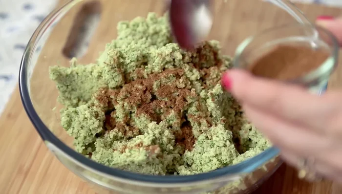 Season the falafel mix: Add cumin seed powder, red chili powder, coriander powder, pepper powder, salt, baking soda, and rice flour (optional). Mix well.