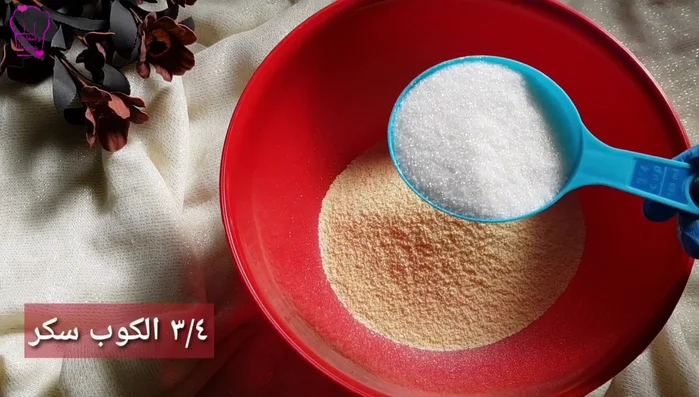 Combine semolina, sugar, baking powder, baking soda, and cinnamon in a bowl. Mix until well distributed.